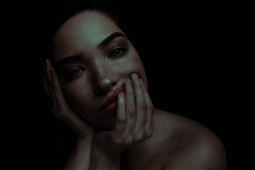 Woman who understood acne marks vs acne scars and hyperpigmentation posing in front of the camera.