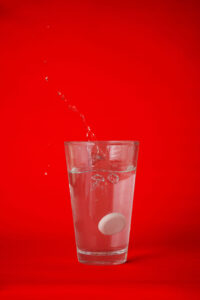 Collagen effervescent tablet dropped in a glass of water. This is for the post: Is collagen bad for kidneys?
